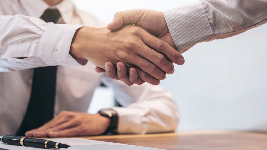 Two businessmen shaking hands