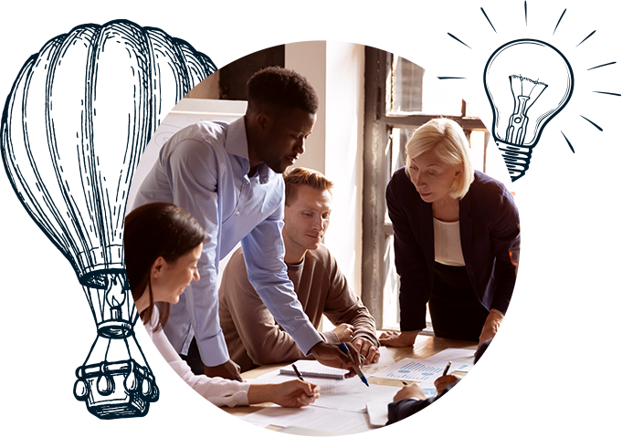 Group of people looking at business plans
