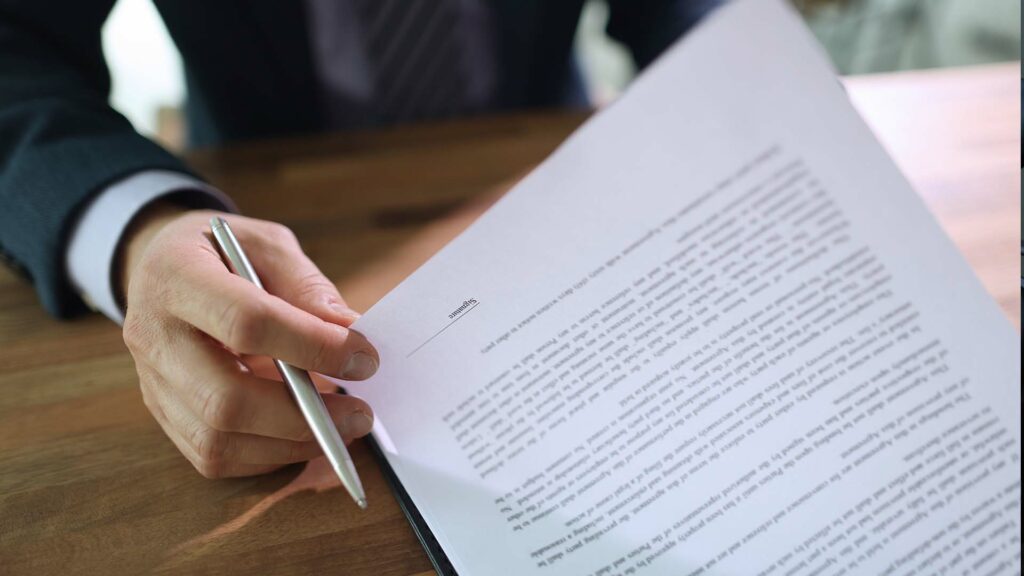 Closeup of businessman reviewing contract