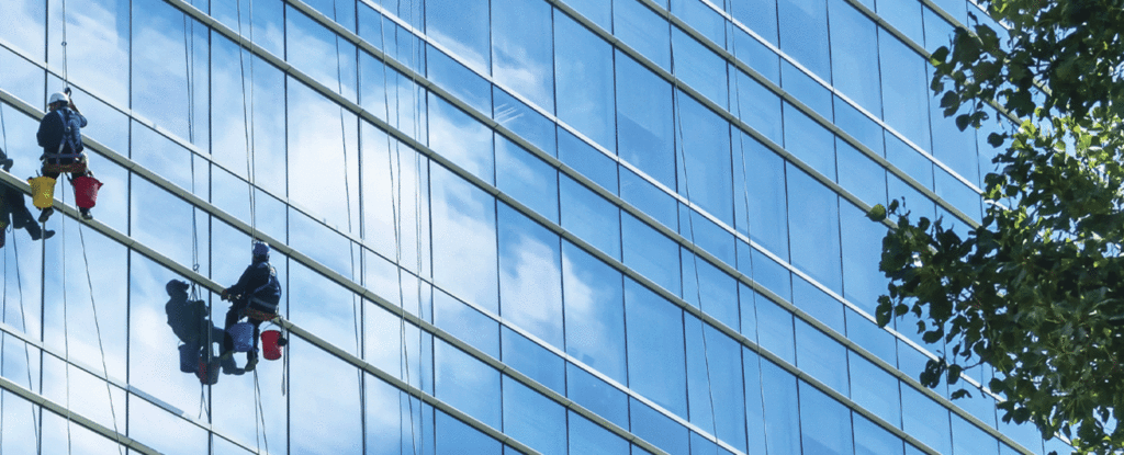 2 men window washing a high-rise building