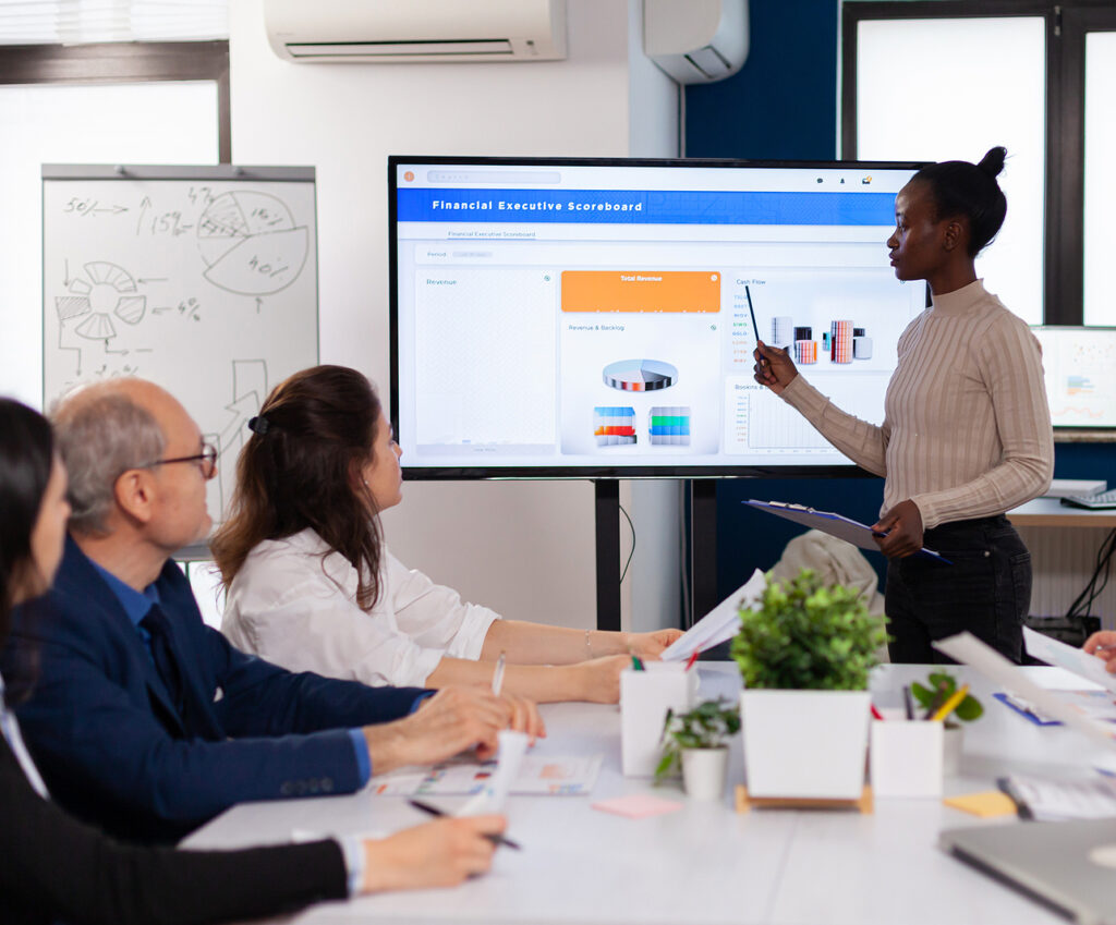 Corporate staff discussing new business application with colleagues