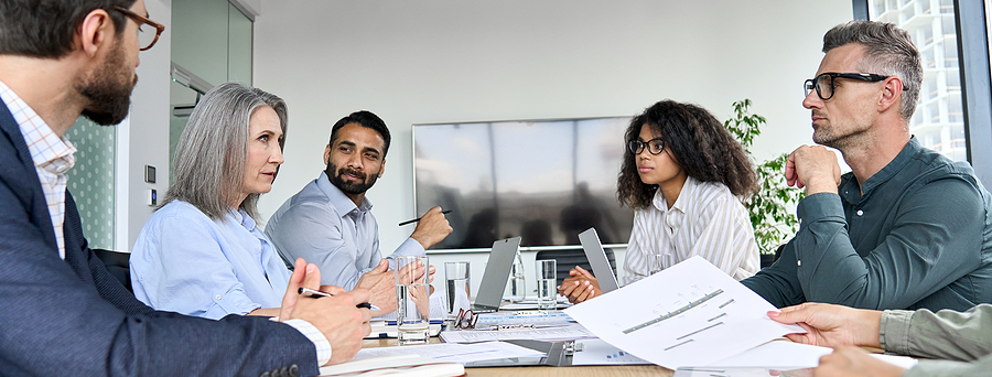 Executives talking during a board meeting